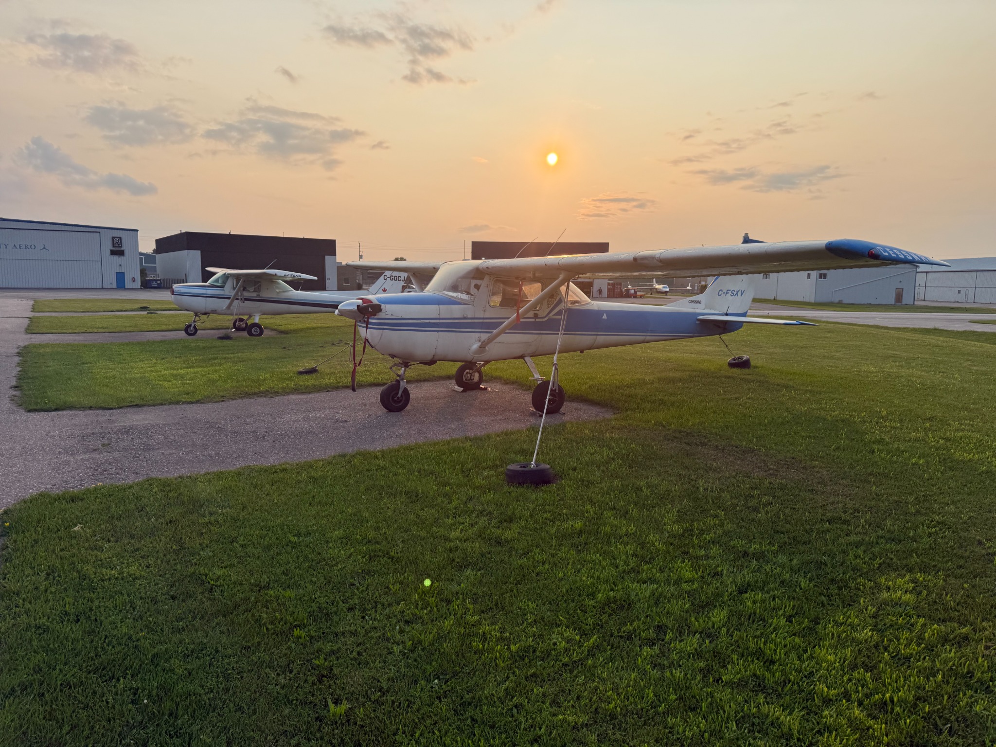 Cessna 150 parked at sunset